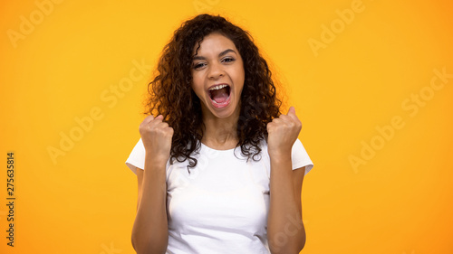 Happy black female showing success gestures, achievement happiness, excitement