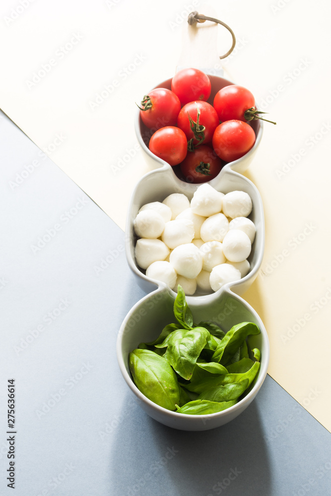 Mini mozzarella cheese, tomatoes and green basil. Mini mozzarella cheese, tomatoes and green basil.