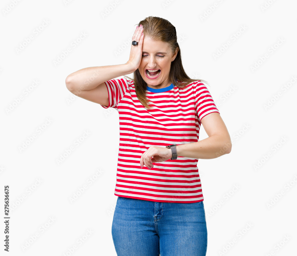 Middle age mature woman wearing casual t-shirt over isolated background Looking at the watch time worried, afraid of getting late Middle age mature woman wearing casual t-shirt over isolated background Looking at the watch time worried, afraid of getting late