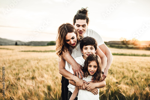 Portrait of a happy and fun family in the countryside. Concept of love family