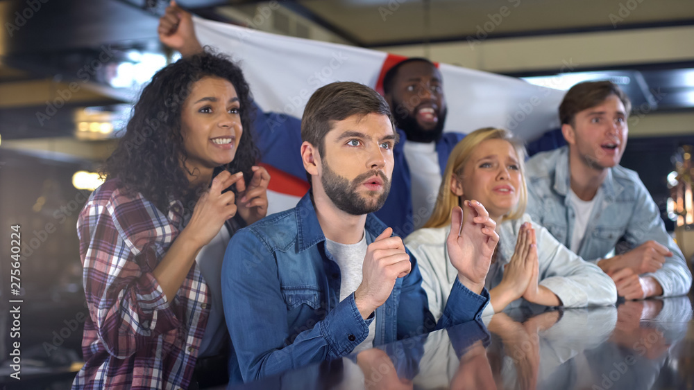 Φωτογραφία Sport fans waving English flag, supporting national team, upset about defeat