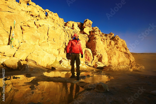 lonely man travels along deserted canyon, desert, lifeless terrain, landscape of highlands