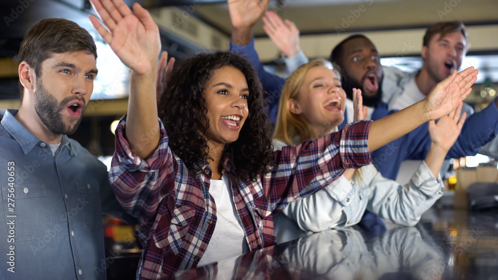 Fototapeta premium Young sport fans cheering national team victory, supporters clapping hands