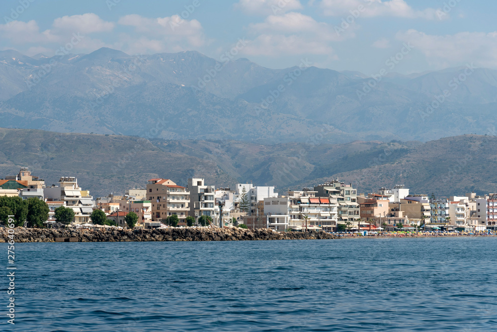Chania, Crete, Greece. June 2019. The coastal landscape of Chania northern Crete showing hotels and homes with a backdrop of mountains