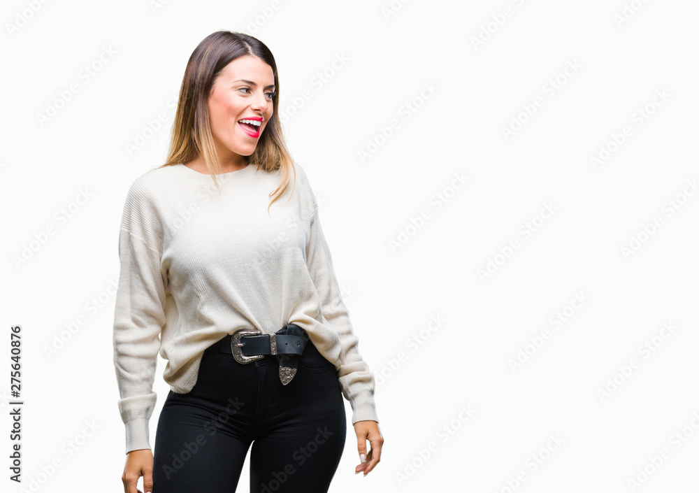 Young beautiful woman casual white sweater over isolated background looking away to side with smile on face, natural expression. Laughing confident. Young beautiful woman casual white sweater over isolated background looking away to side with smile on face, natural expression. Laughing confident.