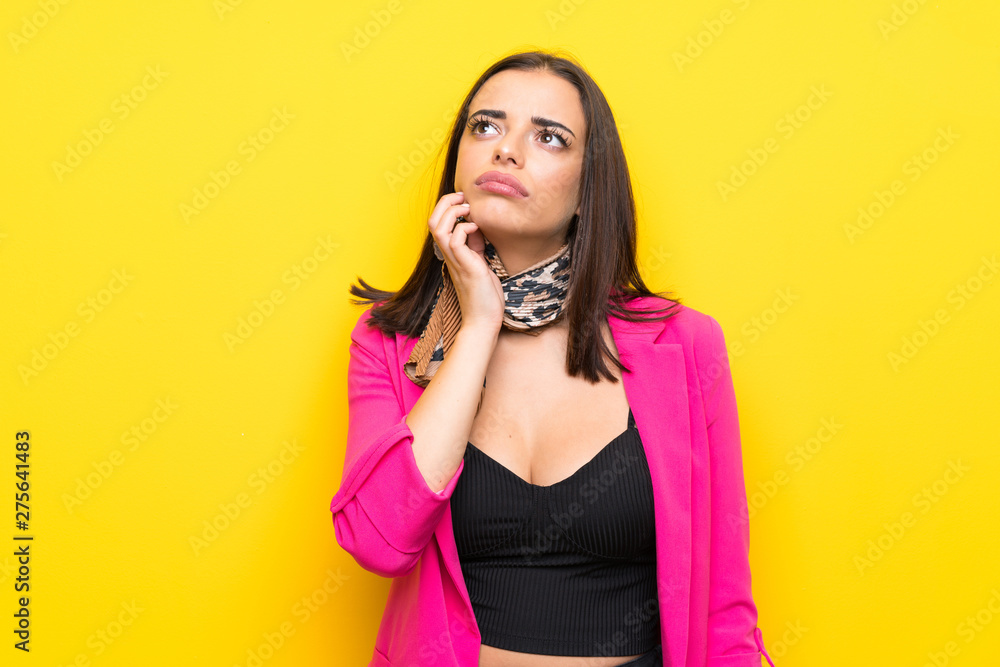 Young woman over isolated yellow background thinking an idea Young woman over isolated yellow background thinking an idea