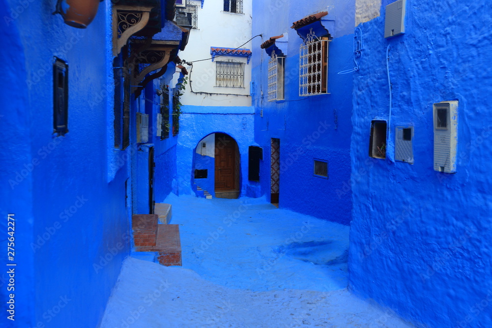 Blue street walls of the popular city of Morocco, Chefchaouen. Traditional moroccan architectural details.