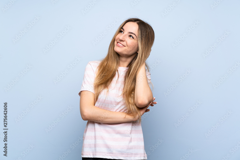Young woman over isolated blue background thinking an idea Young woman over isolated blue background thinking an idea