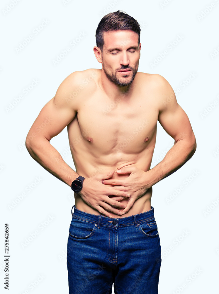 Handsome shirtless man showing nude chest with hand on stomach because nausea, painful disease feeling unwell. Ache concept. Handsome shirtless man showing nude chest with hand on stomach because nausea, painful disease feeling unwell. Ache concept.