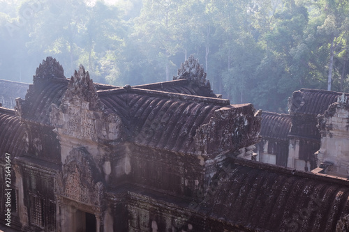 Fragment of an ancient stone temple in Cambodia. The ancient architecture of Southeast Asia. Abandoned temple. photo