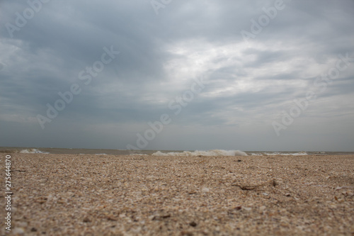 Sea during a storm. Waves against the sky. There is a place for text. Copy space. Summer concept