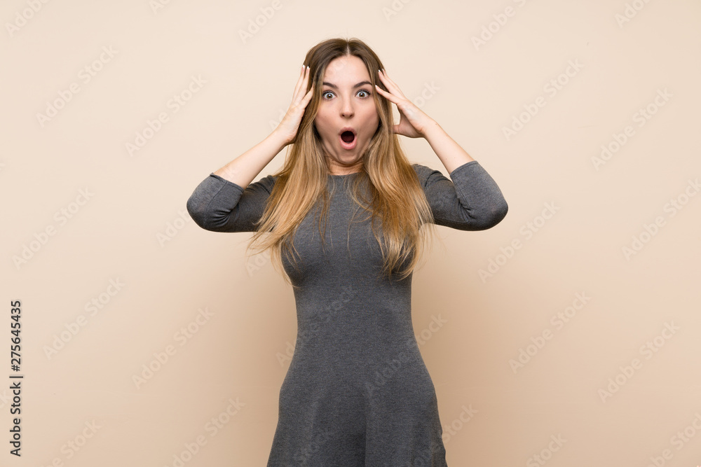 Young woman over isolated background with surprise expression Young woman over isolated background with surprise expression