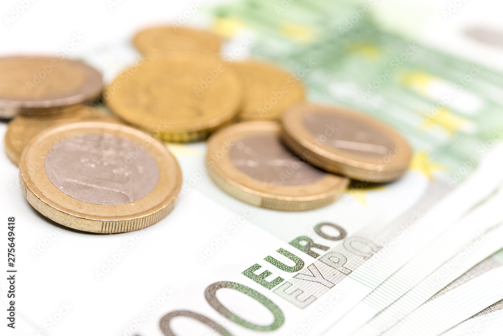 Close-up Stack of Euro banknotes and coins. 500 Euro banknotes. European currency money banknotes isolated on white backdrop. Perspective view closeup. Salary, savings, european union economic crisis Close-up Stack of Euro banknotes and coins. 500 Euro banknotes. European currency money banknotes isolated on white backdrop. Perspective view closeup. Salary, savings, european union economic crisis