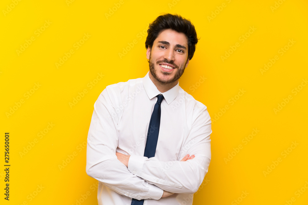 Businessman on isolated yellow background laughing Businessman on isolated yellow background laughing