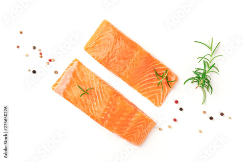 Two slices of fresh raw salmon with pepper and rosemary, shot from the top on a white background with a place for text