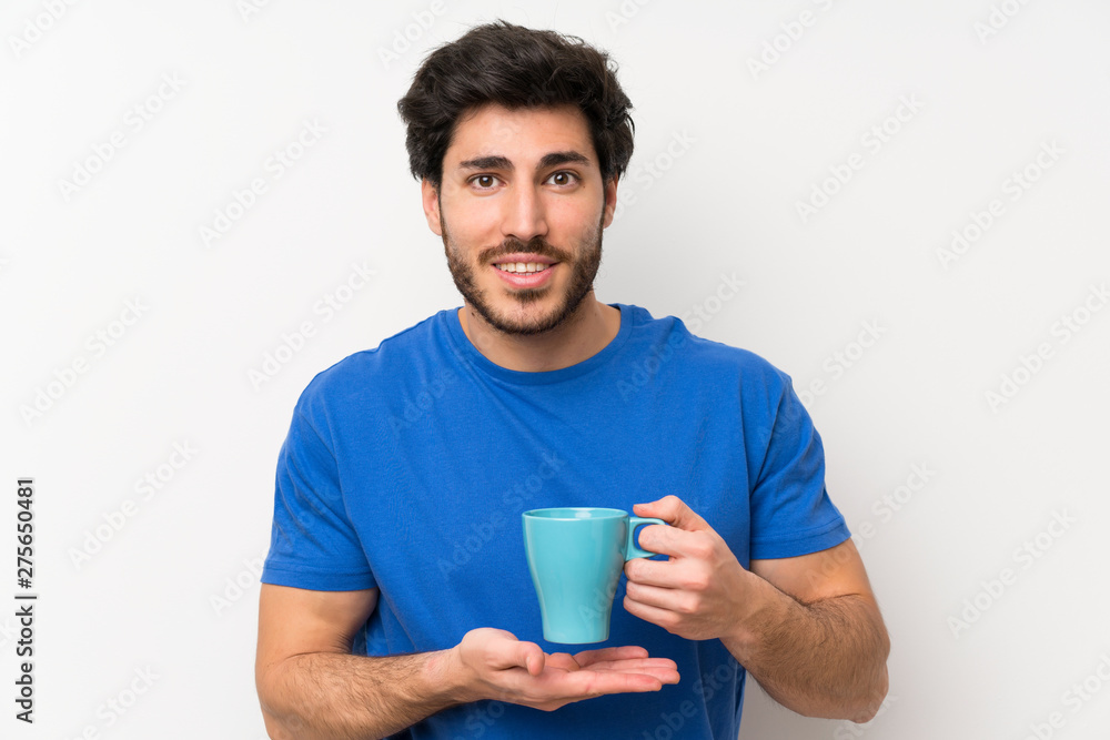 Handsome man holding hot cup of coffee Handsome man holding hot cup of coffee