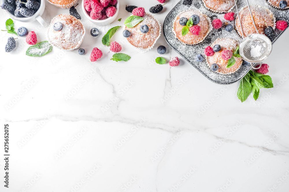 Muffins or cupcakes with berries