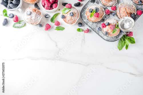 Muffins or cupcakes with berries