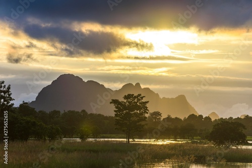 Sunset above tower karst mountains, artificial lake, landscape in the evening light, Hpa-an, Karen or Kayin State, Myanmar, Asia photo