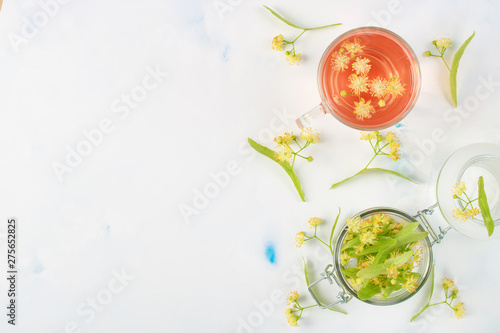 linden blossom and flower tea in a cup for a healthy diet on a white background top view