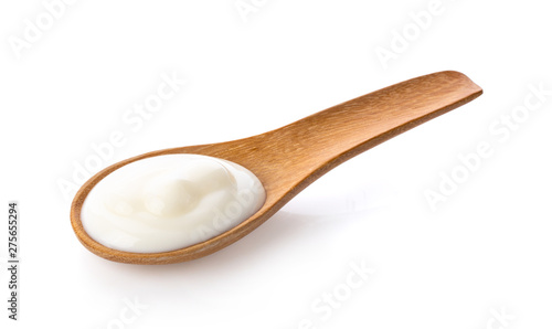 yogurt in wood spoon  isolated on white background from top view