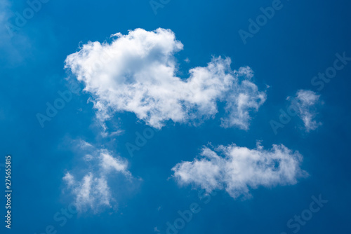 Deep Blue sky background with white clouds