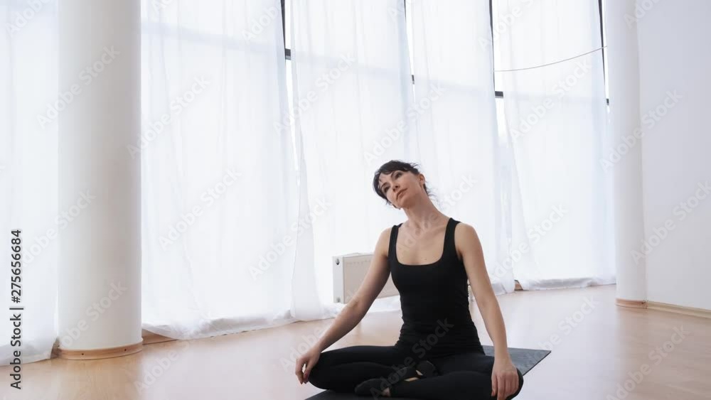 Butterfly posture and neck's stretching made by yoga female couch slow motion Butterfly posture and neck's stretching made by yoga female couch slow motion