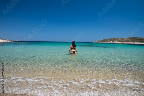 Fototapeta Naklejka Na Ścianę i Meble -  Beautiful woman enjoyin in the amazing bay and beach on Antiparos Island in Cyclades, greece