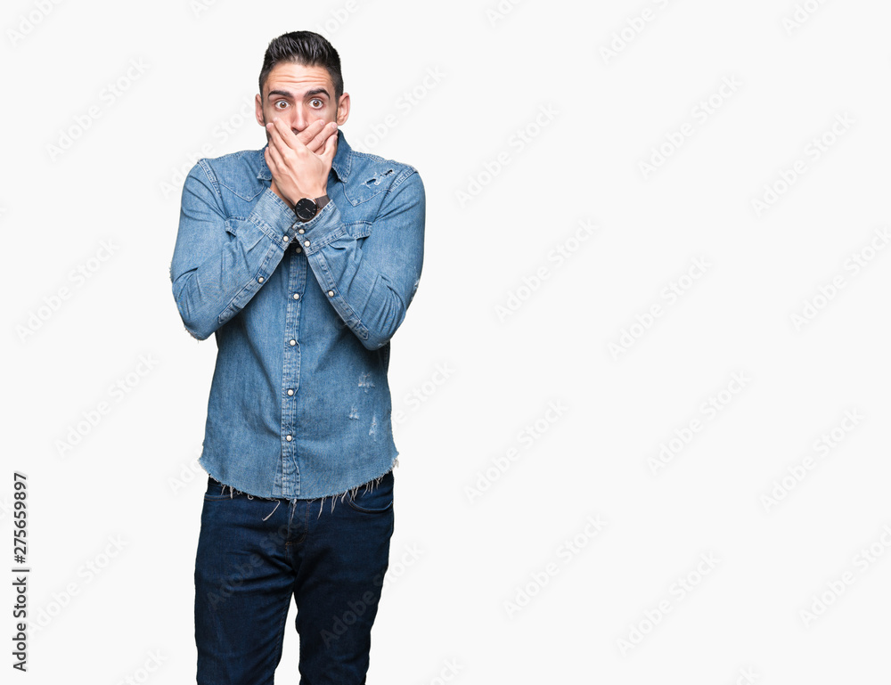 Young handsome man over isolated background shocked covering mouth with hands for mistake. Secret concept. Young handsome man over isolated background shocked covering mouth with hands for mistake. Secret concept.