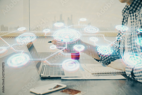 Social network theme hologram with businessman working on computer on background. Concept of world wide web. Double exposure.