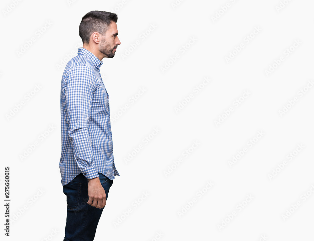 Fototapeta premium Young handsome man over isolated background looking to side, relax profile pose with natural face with confident smile.