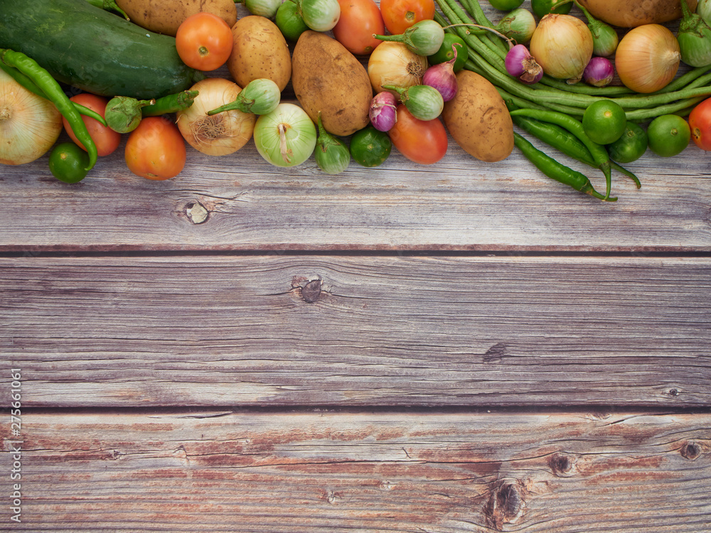 Fresh local vegetables in Asia on a wooden table Fresh local vegetables in Asia on a wooden table