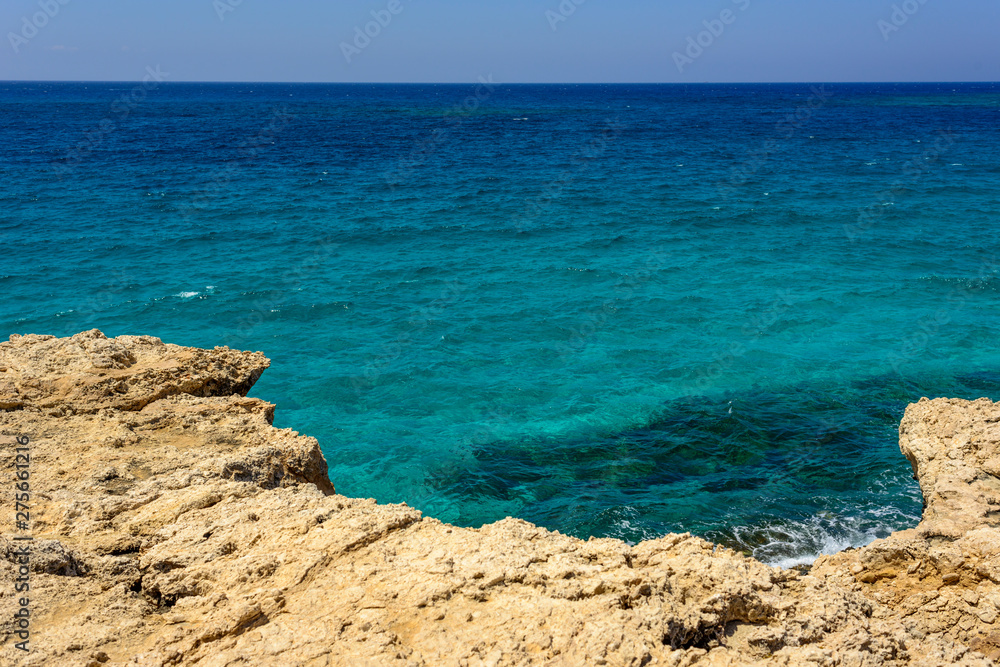 unreal blue and clear sea and rocks off the coast of Ayia Napa, Cyprus unreal blue and clear sea and rocks off the coast of Ayia Napa, Cyprus