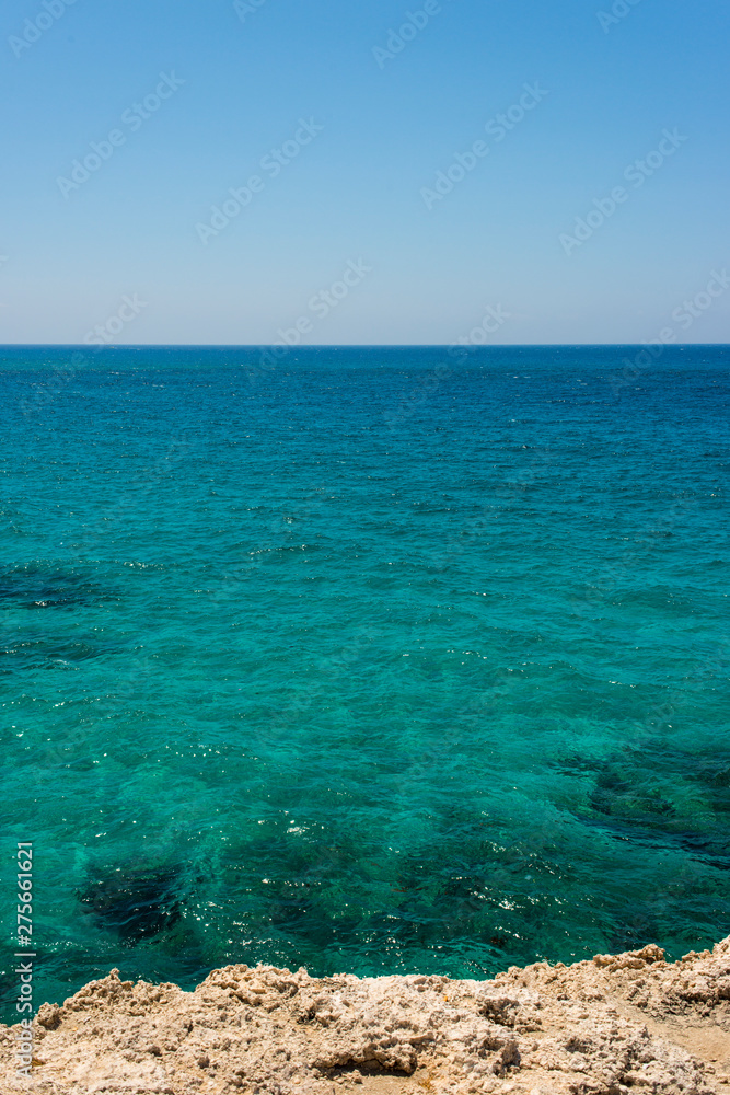 Obraz premium unreal blue and clear sea and rocks off the coast of Ayia Napa, Cyprus