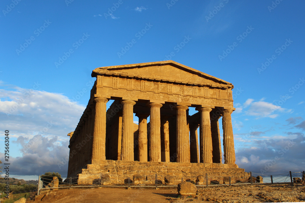 Ancient Temple of Concord in the Valley of Temples against bright blue sky, Agrigento, Italy