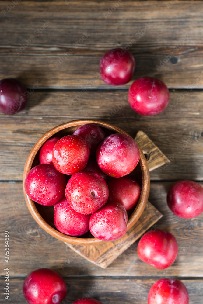 Red plum. Healthy diet. Rustic style Red plum. Healthy diet. Rustic style