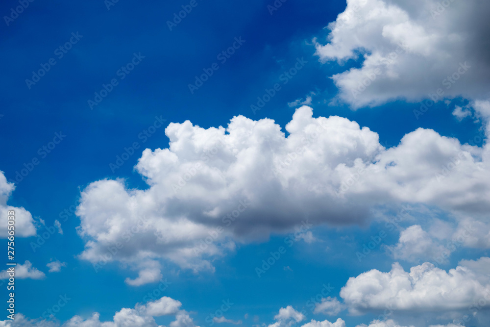 Fototapeta premium The blue sky has white clouds. Small white fluffy clouds against blue