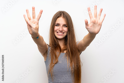 Young woman with long hair over isolated white wall counting nine with fingers