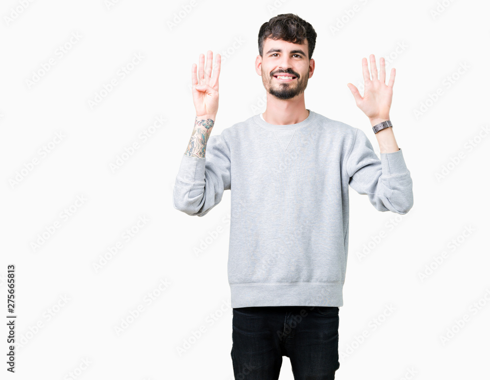 Young handsome man wearing sweatshirt over isolated background showing and pointing up with fingers number nine while smiling confident and happy. Young handsome man wearing sweatshirt over isolated background showing and pointing up with fingers number nine while smiling confident and happy.