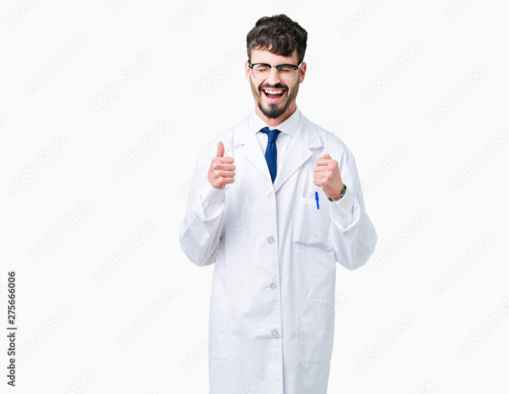Young professional scientist man wearing white coat over isolated background excited for success with arms raised celebrating victory smiling. Winner concept. Young professional scientist man wearing white coat over isolated background excited for success with arms raised celebrating victory smiling. Winner concept.