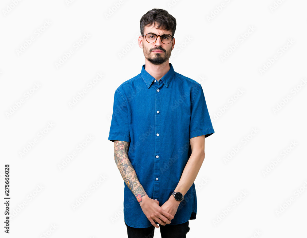Fototapeta premium Young handsome man wearing glasses over isolated background depressed and worry for distress, crying angry and afraid. Sad expression.