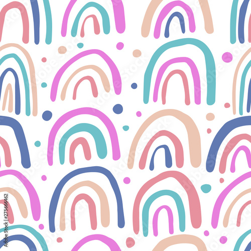 Polka dot wallpaper. Hand drawn rainbows seamless pattern.