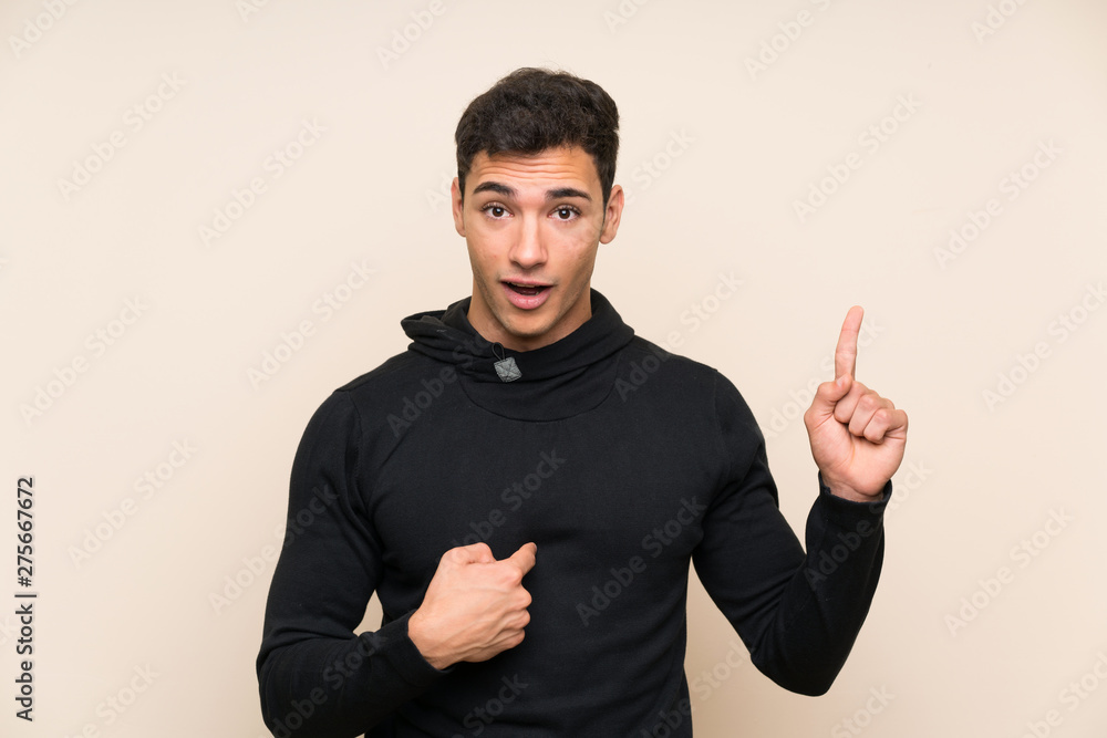 Handsome man over isolated background with surprise facial expression Handsome man over isolated background with surprise facial expression