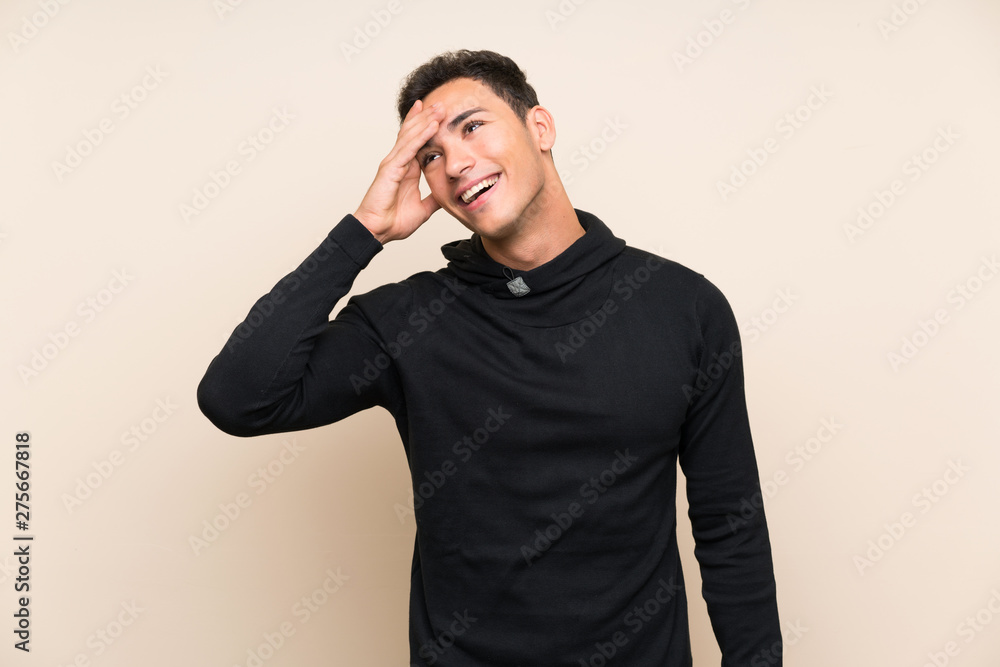 Handsome man over isolated background laughing Handsome man over isolated background laughing