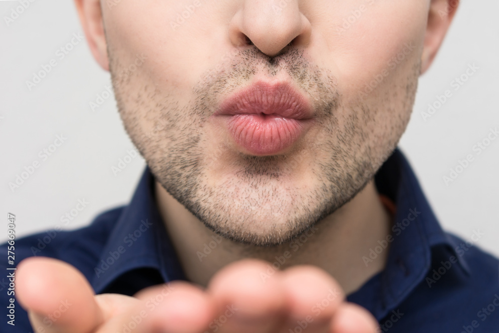 Attractive man sending air kiss, closeup Attractive man sending air kiss, closeup