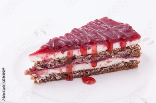 Slice of fresh, delicious homemade cake with strawberries sauce