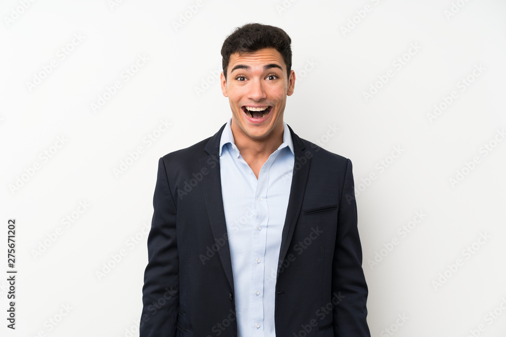 Handsome man over isolated white wall with surprise facial expression Handsome man over isolated white wall with surprise facial expression