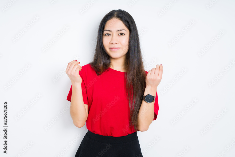 Beautiful brunette woman wearing red t-shirt over isolated background Doing money gesture with hand, asking for salary payment, millionaire business Beautiful brunette woman wearing red t-shirt over isolated background Doing money gesture with hand, asking for salary payment, millionaire business
