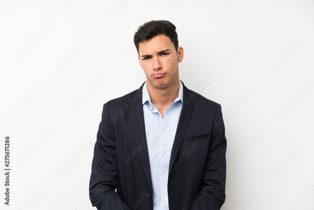 Handsome man over isolated white wall sad Handsome man over isolated white wall sad