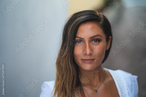 Fashion Model in White Dress and Tan